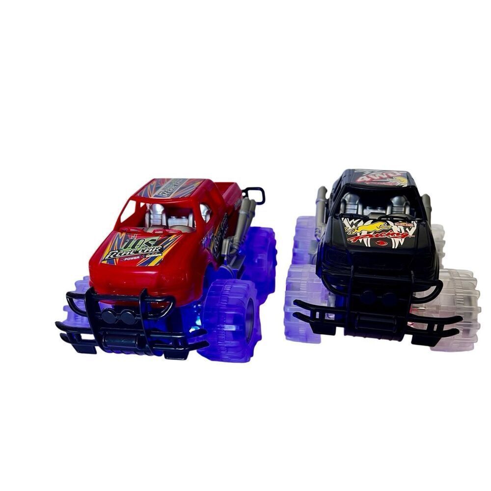 2  RED & BLACK 6 INCH LONG "RCAE" MONSTER TRUCKS WITH FLASHING LED LIGHTS